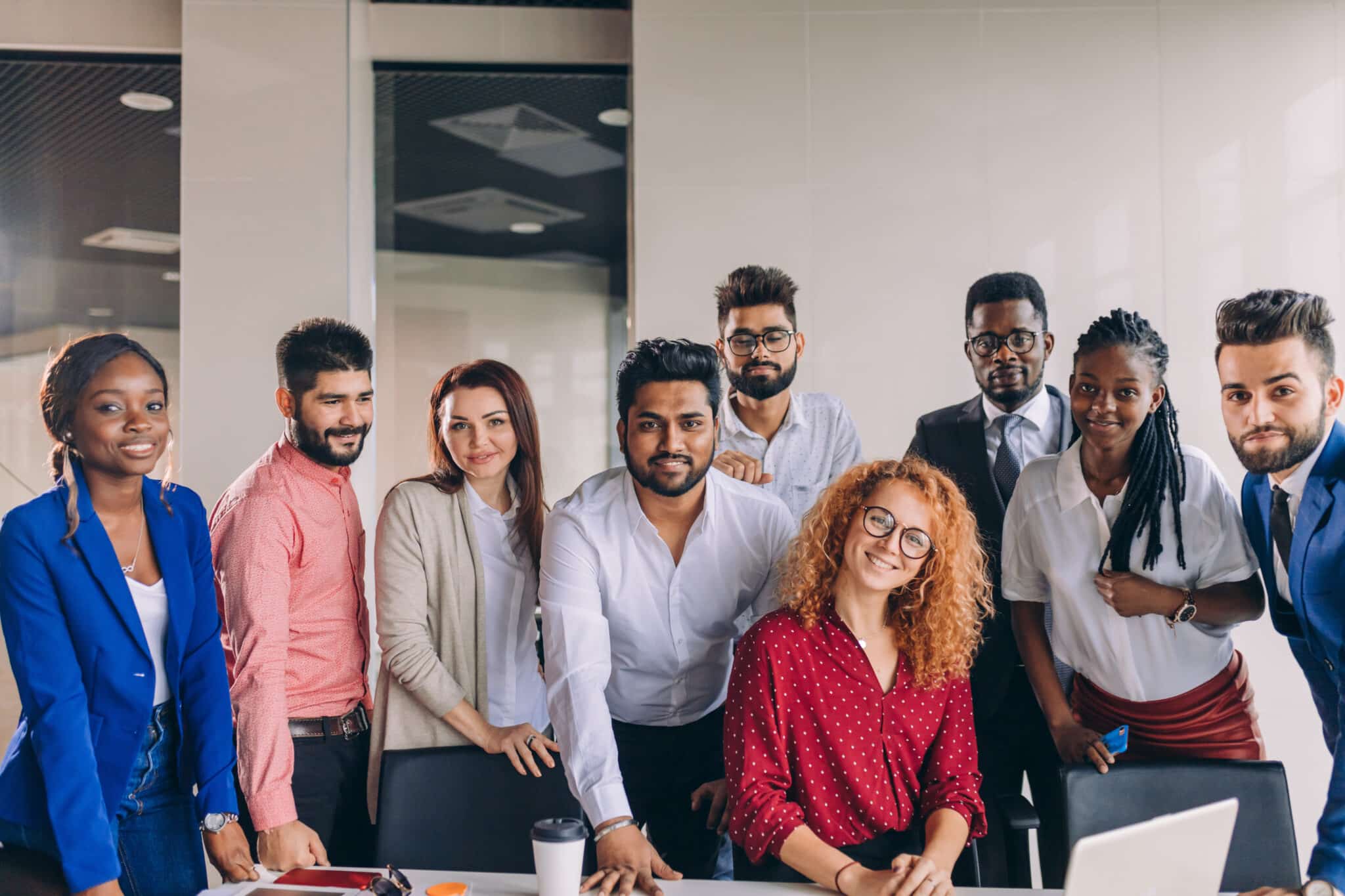 young and successful mixed race business people looking at camera